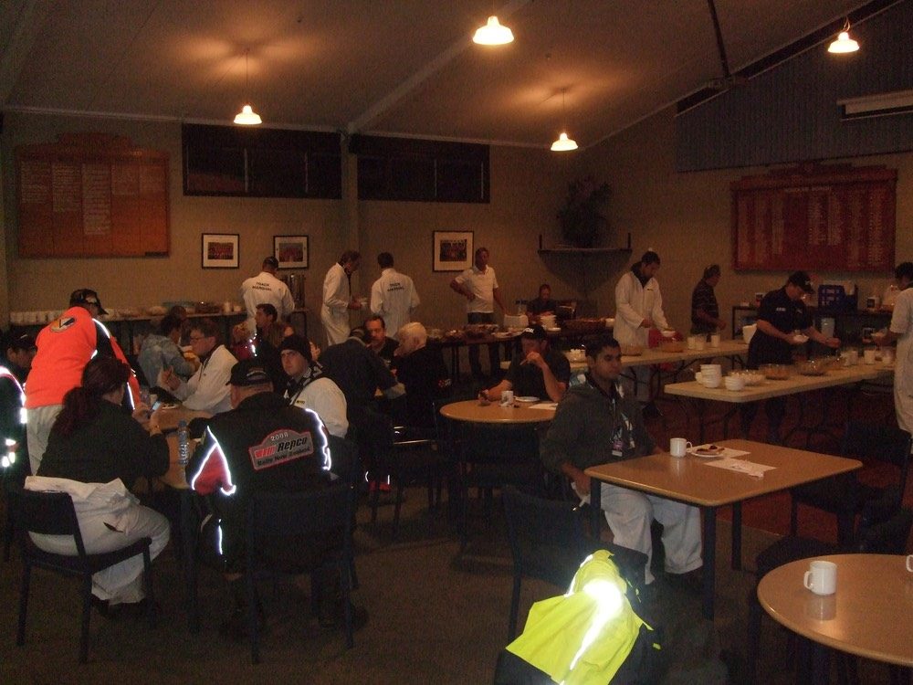 Officials and volunteers in the clubrooms between sessions